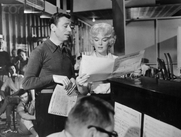 1960 --- Billionaire Jean-Marc Clement (Yves Montand) and singer Amanda Dell (Marilyn Monroe) rehearsing a musical number in the film Let's Make Love. Released in 1960. --- Image by © Underwood & Underwood/Corbis